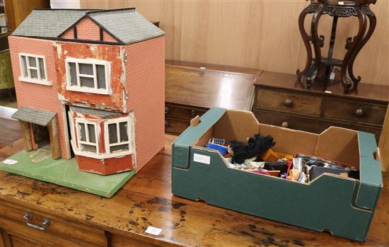 A dolls house with furniture W.50cm